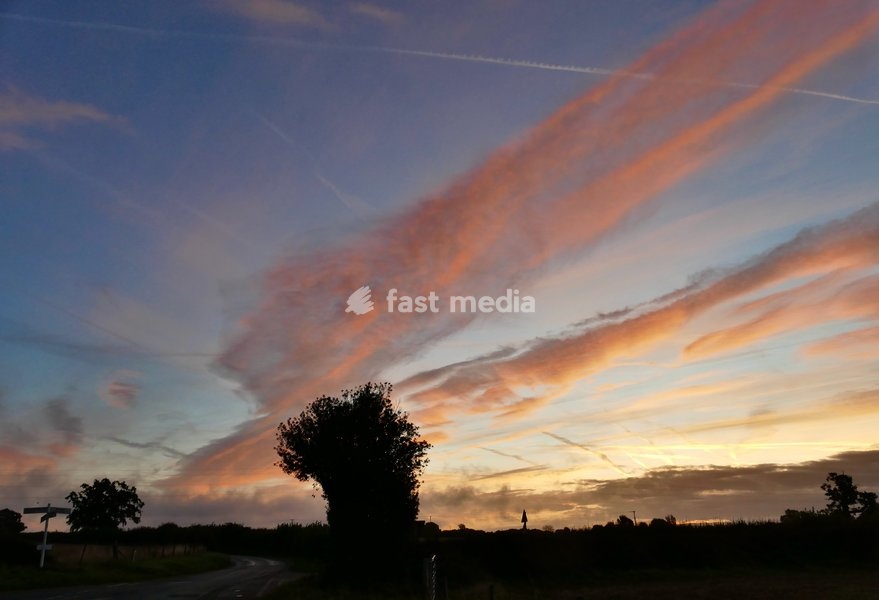 Pretty skies at daybreak as the sun rises over the countryside