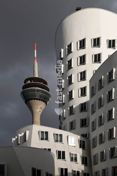 Düsseldorf, The "Neue Zollhof" (architect: Frank O. Gehry) with the Rheinturm (television tower) in the background. Dusseldorf, November 2nd, 2022