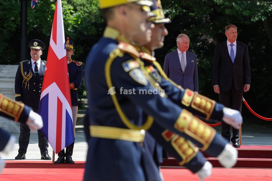 Handout photo issued by Buckingham Palace of President Iohannis (right) and King Charles III receiving the Guard of Honour at Cotroceni Palace during a private visit to Bucharest, Romania. Issue date: Friday June 2, 2023. NOTE TO EDITORS: This handout photo may only be used for editorial reporting…