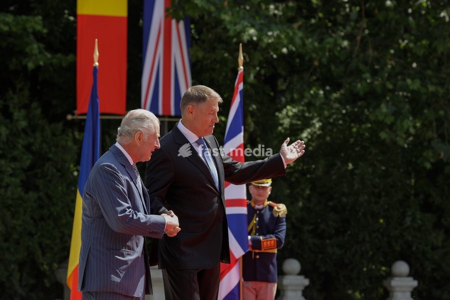 Handout photo issued by Buckingham Palace of President Iohannis (right) and King Charles III receiving the Guard of Honour at Cotroceni Palace during a private visit to Bucharest, Romania. Issue date: Friday June 2, 2023. NOTE TO EDITORS: This handout photo may only be used for editorial reporting…