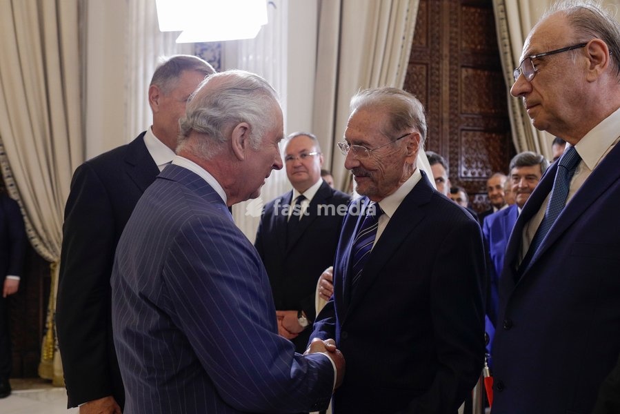 Handout photo issued by Buckingham Palace of King Charles III shaking hands with former Romanian president Emil Constantinescu (second right), during a reception held in his honour, marking 25 years since his first visit to Romania, at Cotroceni Palace during a private visit to Bucharest, Romania.…