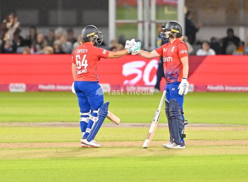 Alice Capsey (England) reaches her individual score of 50 and is congratulated by Heather Knight (Capt)(England) during the England v Sri Lanka Women's International T20 at the 1st Central County Ground, Hove, East Sussex, UK on 31 August 2023