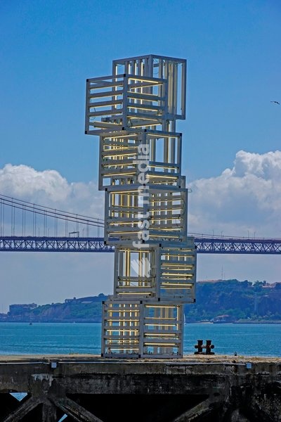 Portugal, Lisbon, Escultura de Luz installation by Pedro Cabrita Reis in front of Museum MAAT, Museum of Art, Architecture and Technology, designed by architect Amanda Levete, located on the banks of the Tagus in Belem district. Modern art sculpture on the banks of the Tagus River