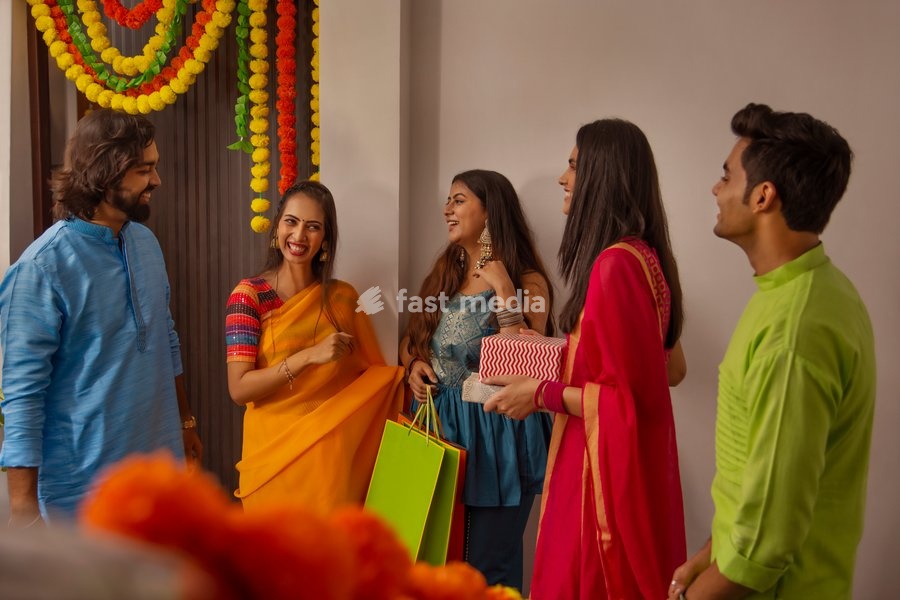 Group of friends arriving at house on the occasion of Diwali