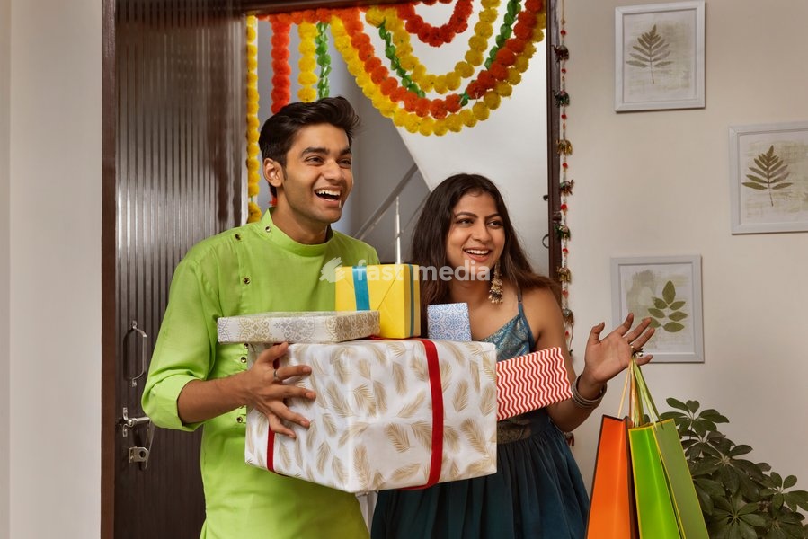 Group of friends arriving at house with gifts on the occasion of Diwali