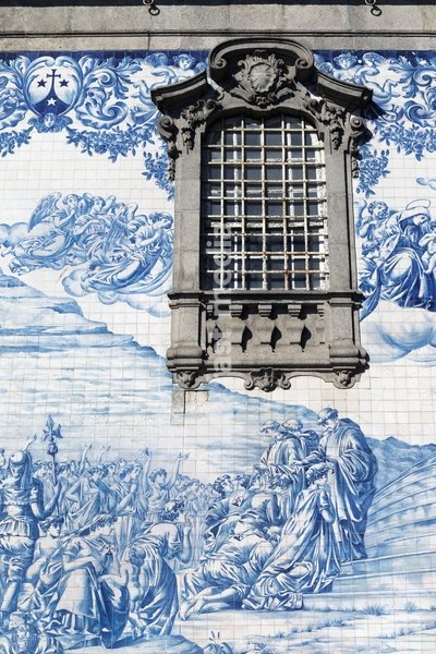 Porto, Portugal. Azulejos decorating the exterior of the Igreja do Carmo. The church was built in the mid-18th century. The tiles, designed by Silvestro Silvestri, were added in 1912. The historic centre of Porto is a UNESCO World Heritage Site