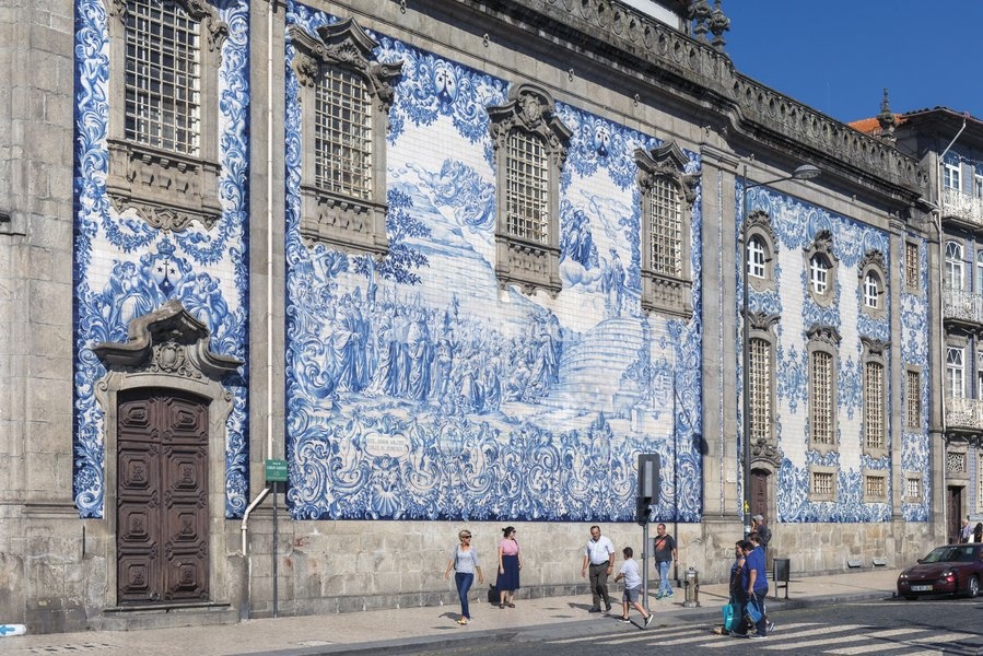 Porto, Portugal. Azulejos decorating the exterior of the Igreja do Carmo. The church was built in the mid-18th century. The tiles, designed by Silvestro Silvestri, were added in 1912. The historic centre of Porto is a UNESCO World Heritage Site
