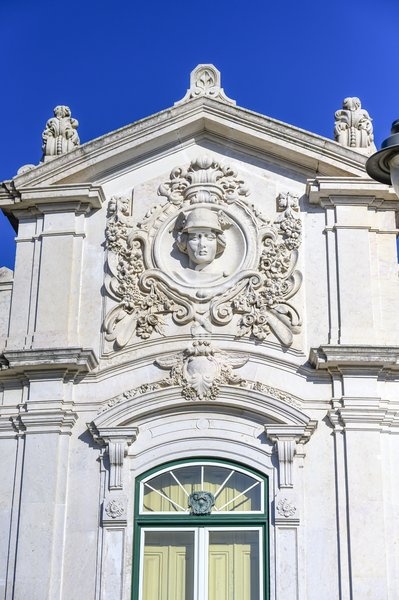 Lisbon, Portugal, Sculpture decoration in facade of a colonial style building in Lisbon city