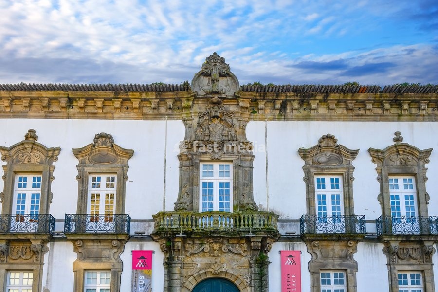 Porto, Portugal, Ancient facade of the Episcopal Palace located in the side of the Porto Cathedral. The old architecture building is a famous place and landmark in the city