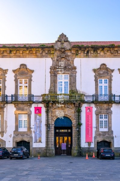 Porto, Portugal, Ancient facade of the Episcopal Palace located in the side of the Porto Cathedral. The old architecture building is a famous place and landmark in the city