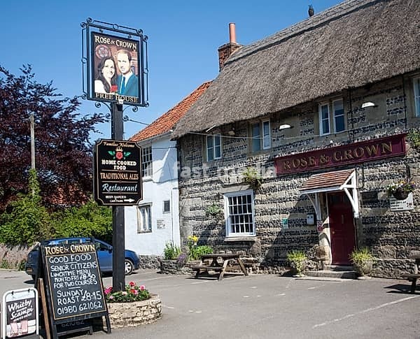 Rose and Crown pub, Tilshead, Wiltshire, England, UK, sign of Prince William and his wife Kate Middleton