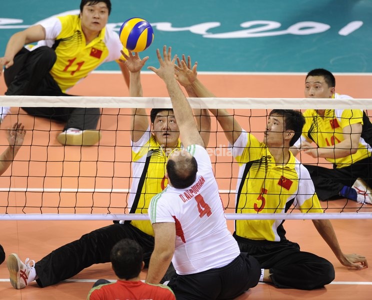 (101218) -- GUANGZHOU, Dec. 18, 2010 () -- Iran's Davoud Alipourian (Number 4) spikes during the men's sitting volleyball final against China at the 2010 Asian Para Games in Guangzhou, capital city of south China's Guangdong Province, Dec. 18, 2010. Iran beat China 3-1 and claimed the title of the…