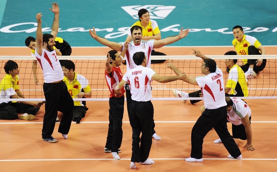 (101218) -- GUANGZHOU, Dec. 18, 2010 () -- Players of Iran celebrate their victory over China during the men's sitting volleyball final at the 2010 Asian Para Games in Guangzhou, capital city of south China's Guangdong Province, Dec. 18, 2010. Iran beat China 3-1 and claimed the title of the event