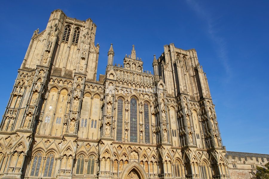 The historic western facade of Wells Cathedral, with its twin square towers, in Wells, Somerset, England, United Kingdom, Europe