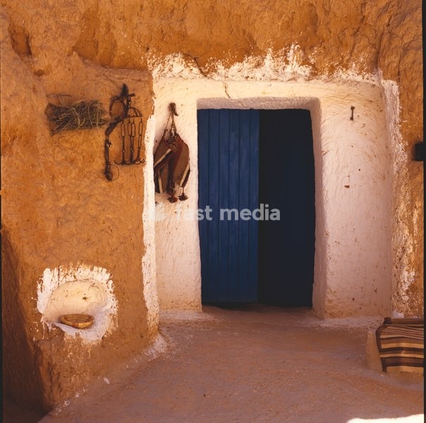 A door off a courtyard leads into sleeping quarters of a troglodyte family in Matmata, Tunisia