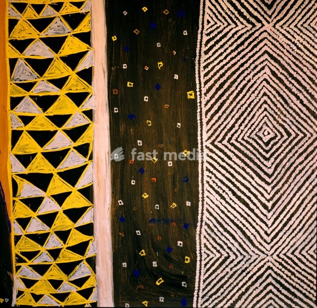 A panel of schematic representations of the Igbo peoples daily life, including a yam beetle with uli motifs on its back and, in the triangle above, a double gong, ogene. A series of narrow vertical panels to the right bear abstract patterns derived from (left to right) a ritual cloth, akwa-nka;…