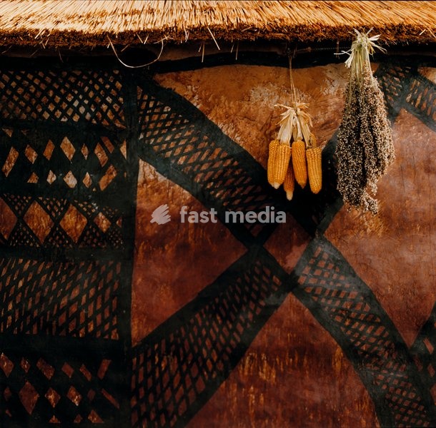 Wall detail with bold criss-cross pattern painted with vegetable dyes by Avokbun Awelinga, a Kusasi from Tilli, Ghana