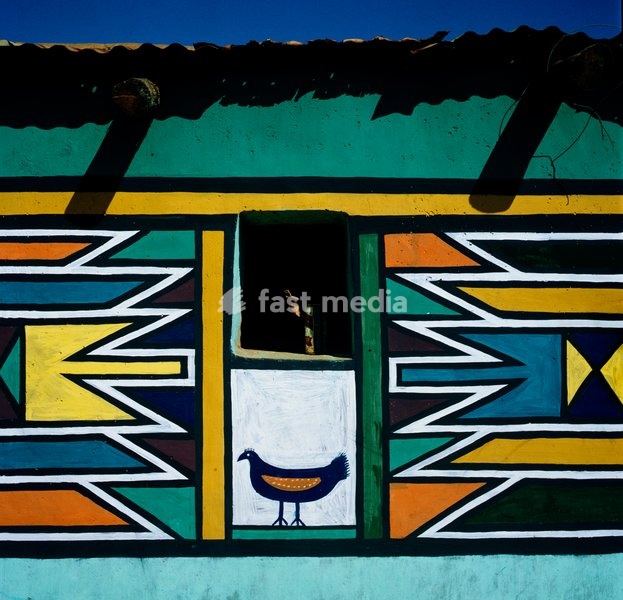 A chicken motif by Martha Mtsweni Ndala of Wolwegat farm in the Verena district, subtly divides colourful symmetrical designs. The Ndala family has been living on this farm for three generations. No member of the family has had any school education, and neither of the daughters, aged twenty-four…