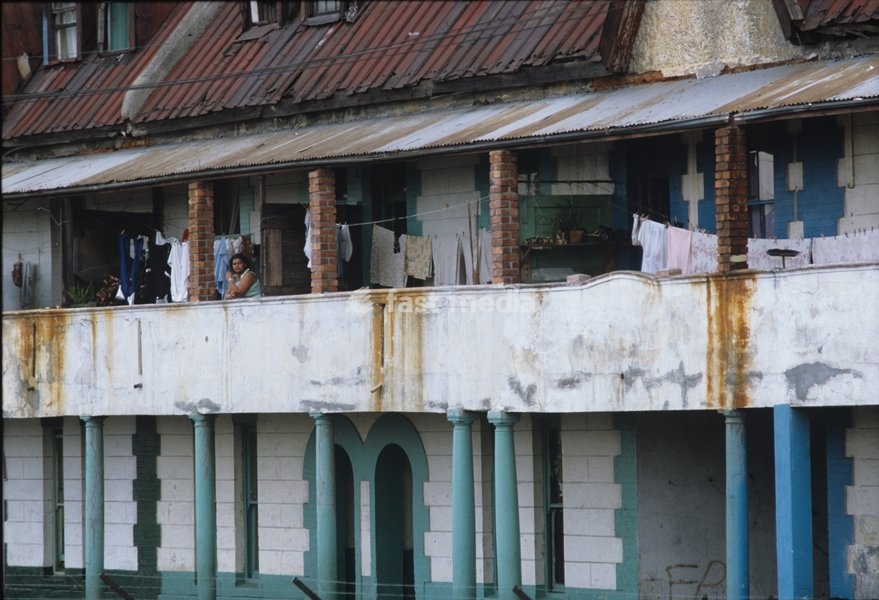 Photo of the facade of a dilapidated residential building