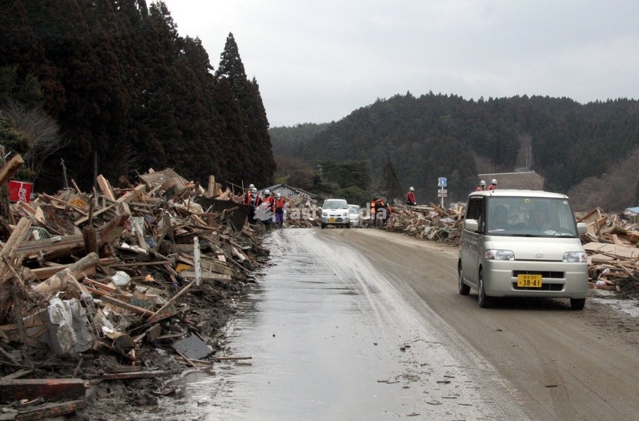 (110315) -- RIKUZEN-TAKATA, March 15, 2011 () -- A car drives past the ruins in the city of Rikuzen-Takata, one of the cities worst hit by Friday's 9 Magnitude quake and ensuing tsunami, Iwate Prefecture, Japan, March 15, 2011