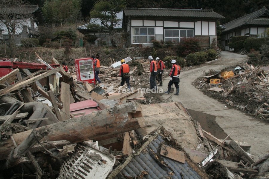 (110315) -- RIKUZEN-TAKATA, March 15, 2011 () -- Rescuers search for mising people in the ruins in the city of Rikuzen-Takata, one of the cities worst hit by Friday's 9 Magnitude quake and ensuing tsunami, Iwate Prefecture, Japan, March 15, 2011
