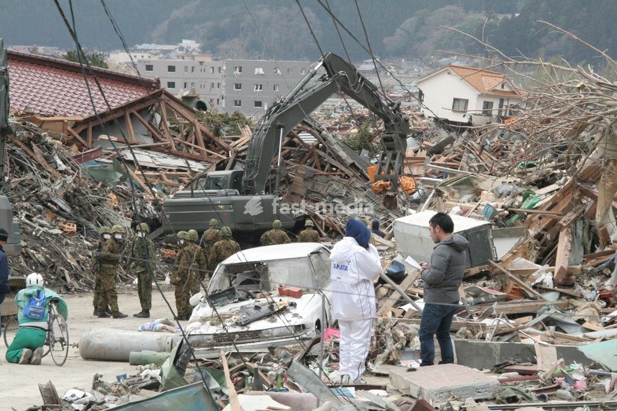 (110315) -- RIKUZEN-TAKATA, March 15, 2011 () -- Rescuers work at the ruins in the city of Rikuzen-Takata, one of the cities worst hit by Friday's 9 Magnitude quake and ensuing tsunami, Iwate Prefecture, Japan, March 15, 2011