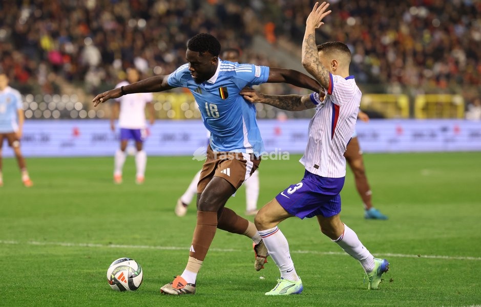 Belgium's Orel Mangala and France's Lucas Digne fight for the ball during a soccer game between Belgian national soccer team Red Devils and France, match 4 (out of 6) in the League A Group 2 of the UEFA Nations League 2025 competition, Monday 14 October 2024 in Brussels