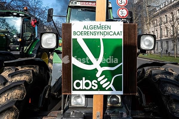 Brussels Capital Region, Belgium, March 3, 2023 Farmers protesting with a union banner for the governmental descision about the use of nitrogen, Europe