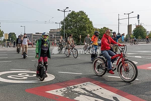Laeken, Brussels Capital Region, Belgium, Brussels, 09 24 2021: People of all ages driving the bike and monewheels at car free sunday, Europe