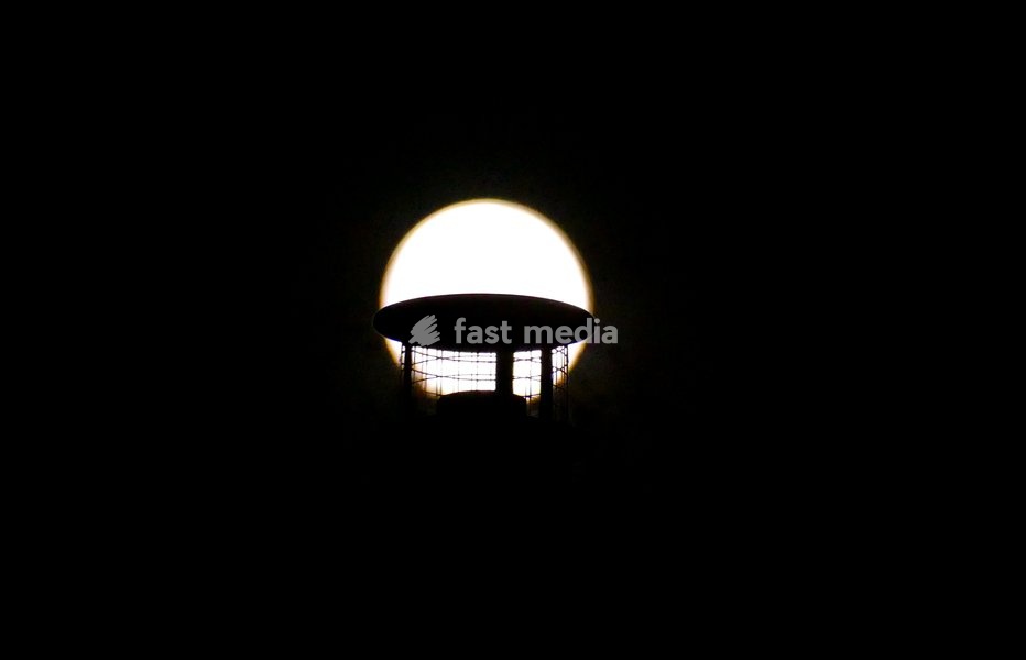 The Hunters Moon, super moon visible over the woods in the evenings sky. Super moons happen when the Moon is closest to the Earth, appearing much bigger and brighter than normal. October's full Moon is called the Hunter's Moon because it occurs when hunters would traditionally have been most active