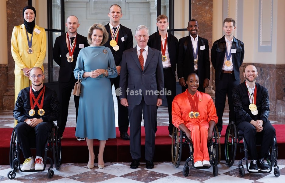 Belgian olympic and paralympic medalists pose with Belgian royal couple with Back L-R, Belgian taekwondoka Sarah Chaari, Belgian athlete Tim Celen , Belgian Ewoud Vromant, Belgian Laurens Devos, Belgian athlete Bashir Abdi, Belgian cyclist Fabio Van den Bossche and front, L-R, Belgian Maxime…