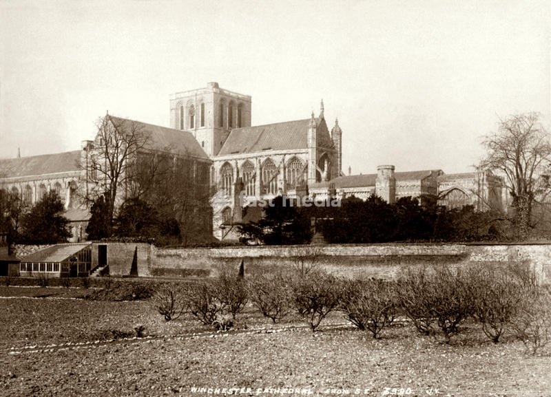 1890 ca , WINCHESTER , Hampshire , GREAT BRITAIN : The WINCHESTER Cathedral from South East . It is one of the largest cathedrals in Europe, with the longest nave and greatest overall length of any Gothic cathedral in Europe. Dedicated to the Holy Trinity , Saint Peter , Saint Paul and before the…