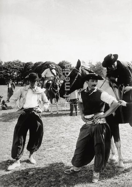 Gauchos before the 'doma de potros' festival during which unsaddled ponies are broken in. Argentina, November 1957 SPECIAL FEE - CONTACT US FOR NOT EDITORIAL USAGE