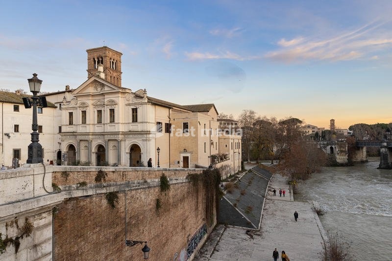Facade of the Basilica of San Bartolomeo all'Isola, seen from the Ponte Cestio. Rome (Italy), December 30th, 2021 SPECIAL FEE - CONTACT US FOR NOT EDITORIAL USAGE