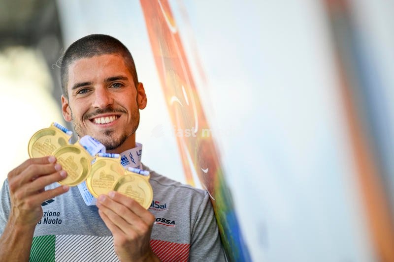 Italian artistic swimmer Giorgio Minisini poses for a picture holding the gold medals won at the XXVI LEN European Championships in Rome, Foro Italico (Italy), August 17th, 2022. Giorgio Minisini won gold medal in Solo Technical, Solo Free, Mixed duet technical and mixed duet free
