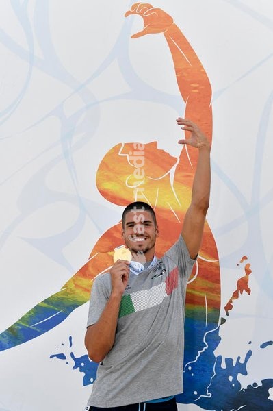 Italian artistic swimmer Giorgio Minisini poses for a picture holding the gold medals won at the XXVI LEN European Championships in Rome, Foro Italico (Italy), August 17th, 2022. Giorgio Minisini won gold medal in Solo Technical, Solo Free, Mixed duet technical and mixed duet free