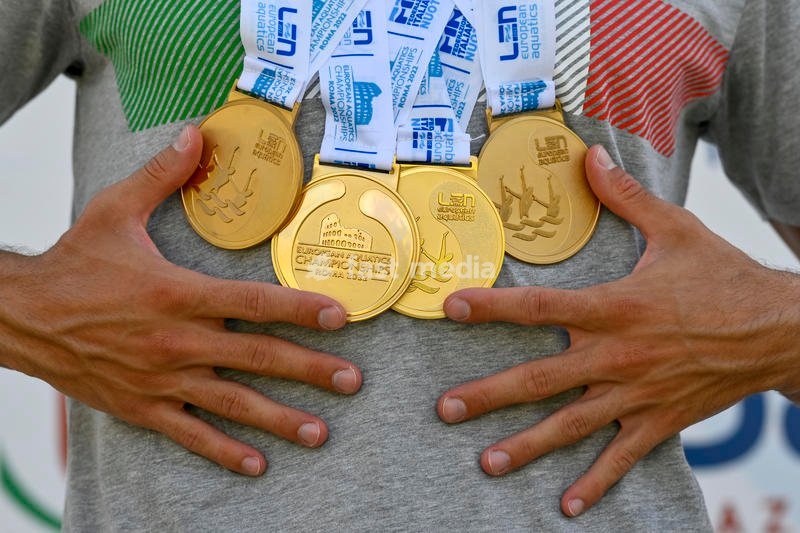 Italian artistic swimmer Giorgio Minisini poses for a picture holding the gold medals won at the XXVI LEN European Championships in Rome, Foro Italico (Italy), August 17th, 2022. Giorgio Minisini won gold medal in Solo Technical, Solo Free, Mixed duet technical and mixed duet free
