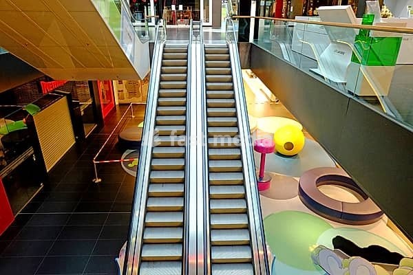 Deserted in lockdown: escalator in the shopping mall