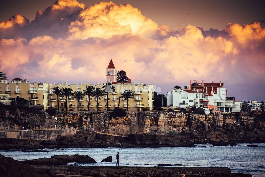 Dramatic magenta sunset in the promenade at Estoril, Portugal, Europe