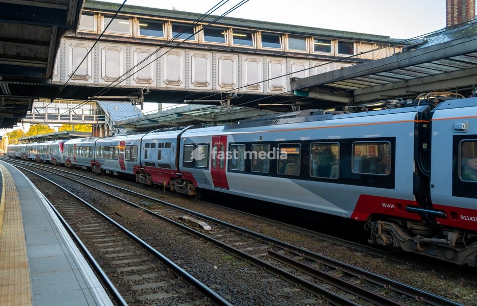 Carriages of long inter-city train at railway station platform, Ipswich, Suffolk, England, UK