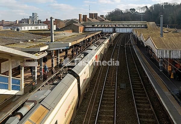 Looking down from above at Greater Anglia train at platforms of Ipswich railway station, Suffolk, England, UK