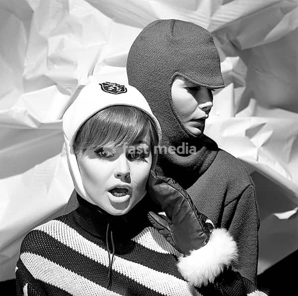 In the 1960s. Fashion models, in typical 1960s winter clothes in a studio. They are wearing warm and covering caps. Sweden 1966