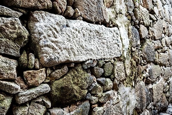 Natural stone wall in the Miragaia neighbourhood, former Jewish quarter, in the city of Porto, Portugal, Europe