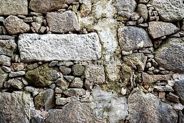 Natural stone wall in the Miragaia neighbourhood, former Jewish quarter, in the city of Porto, Portugal, Europe