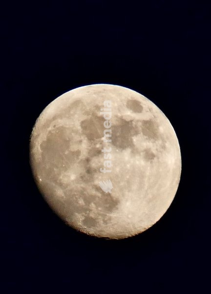 The waxing gibbous moon visible in the dusk sky at 92.8%. This intermediate Moon phase starts after the First Quarter Moon and lasts until the Full Moon